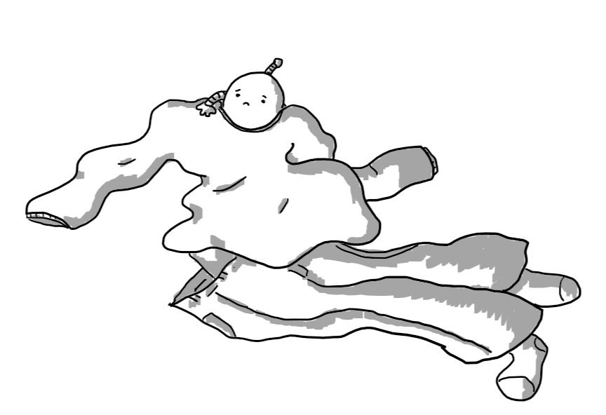 A rather sad-looking robot clambering out of the collar of a crumpled sweater, lying next to some jeans, underpants and socks.