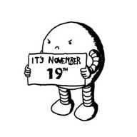 A very grumpy-looking spherical robot holding up a sign that reads "IT'S NOVEMBER 19TH".