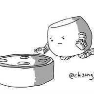 A robot shaped like a squat, rounded sphere, kneeling beside an Amazon Echo, holding out its hands imploringly as it frowns at the truculent machine.