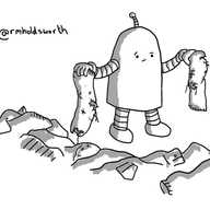 A round-topped robot stands beside a big jumble of clothes, frowningly holding up a pair of much-worn and badly-holed socks.
